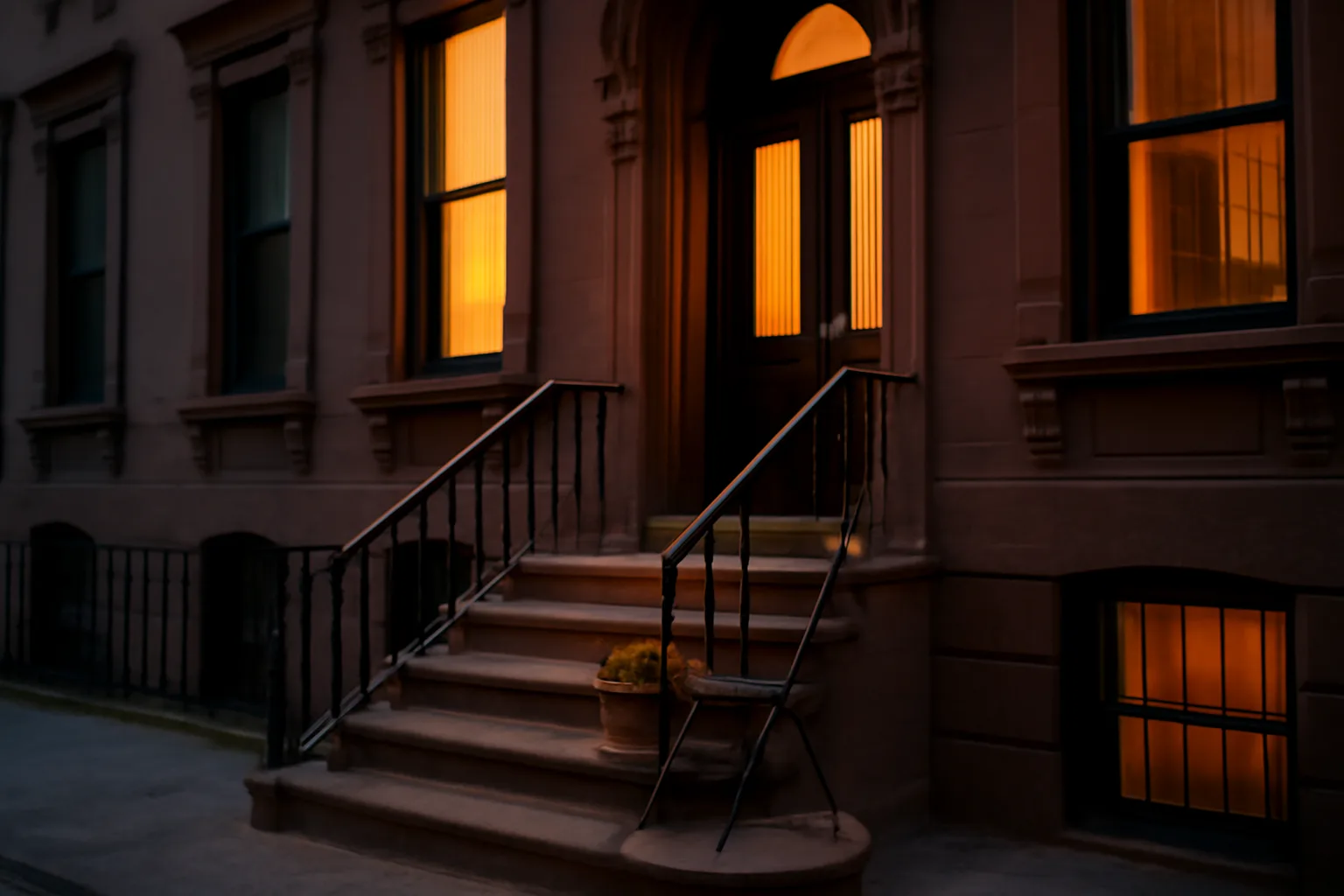 NYC brownstone stoop at dusk representing rules around renting units for events
